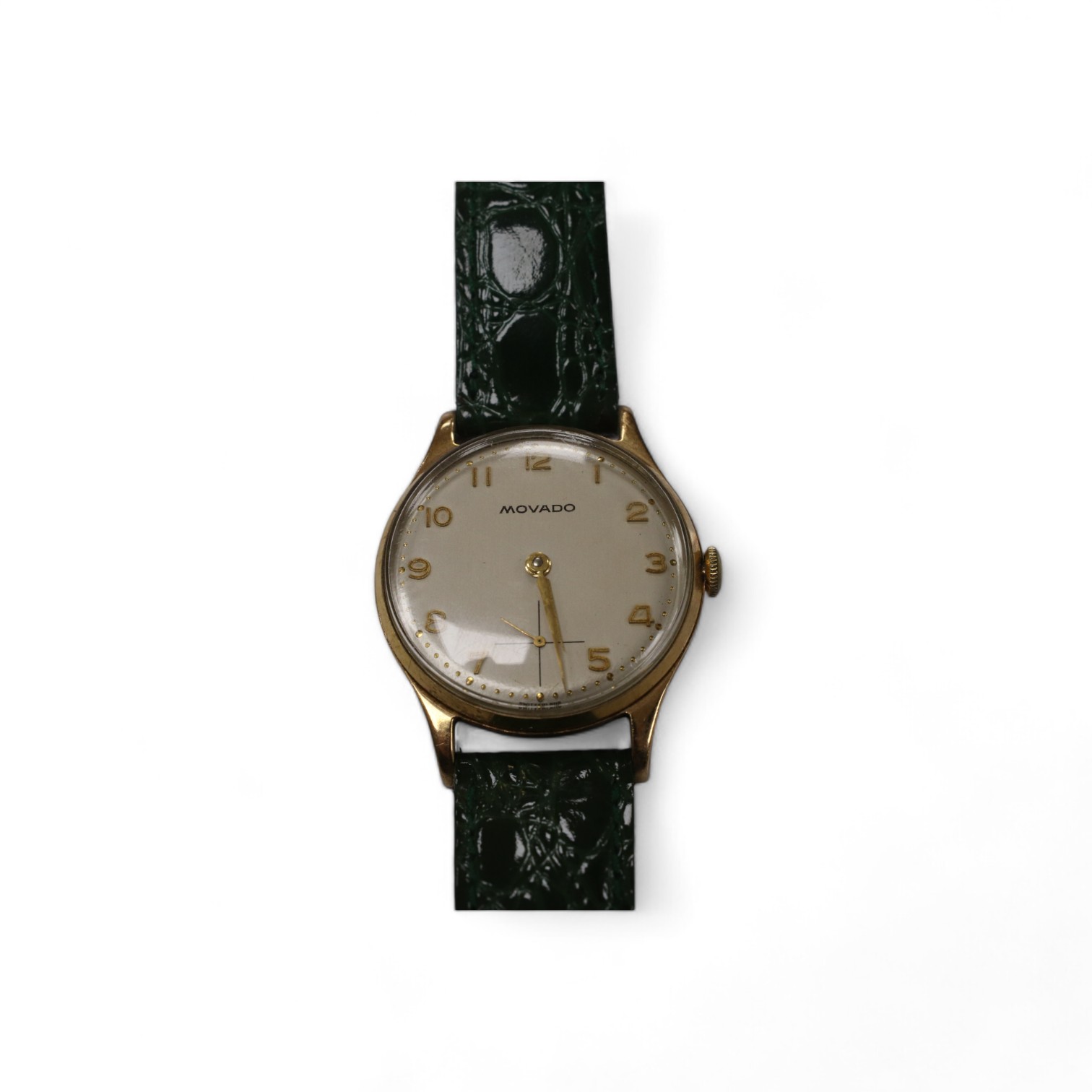 A gentleman's 1950's 9ct gold Movado manual wind wrist watch, with Arabic dial, subsidiary seconds and case back inscription, case diameter 31mm, on a later associated leather strap. Condition - fair